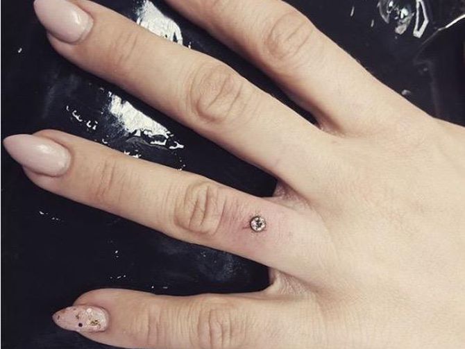 Engagement piercings on ring fingers a new way to say yes